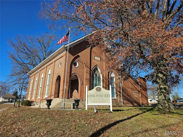 Exterior space with a front lawn