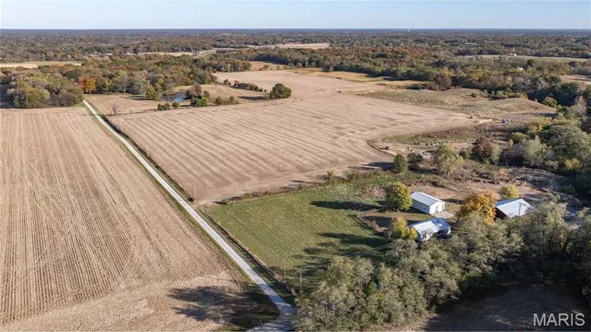 Aerial view of sparsely populated area with extensive farmland