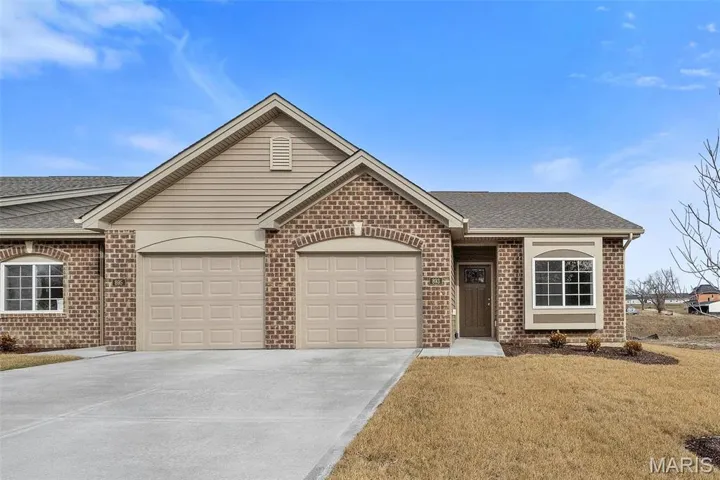 Tasteful Front Elevation with Brick, Vinyl Siding, Box Bay Window and Architectural Shingles.