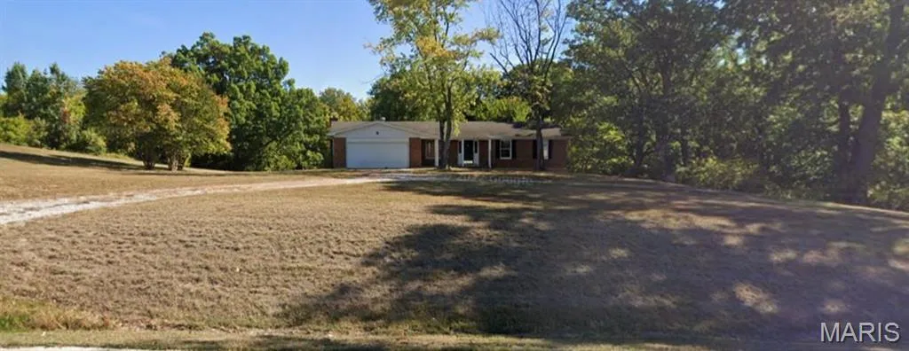 Single story home with a garage