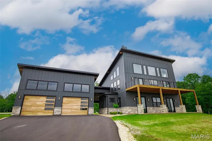 Modern home with a garage and a front yard