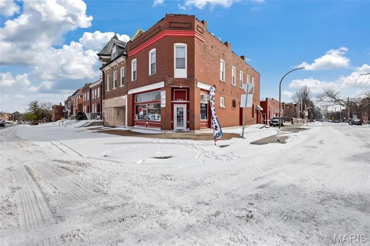 Snow covered building featuring a residential view