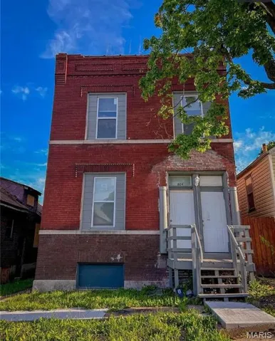 View of front of property featuring brick siding