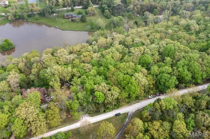 Property goes from just to right of driveway on the left to 391' to the right.