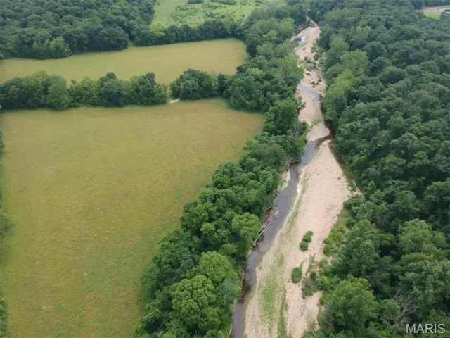 Aerial view of property and surrounding area with rural landscape