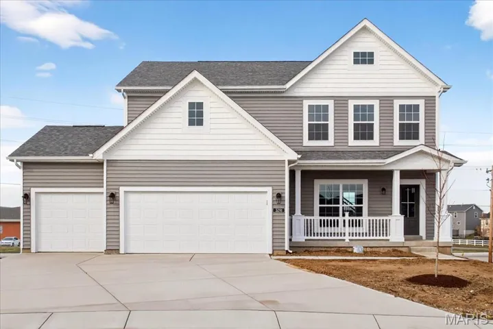 Front Exterior with three car garage!!