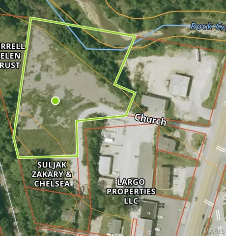 Aerial map of property and surrounding area with property parcel outlined