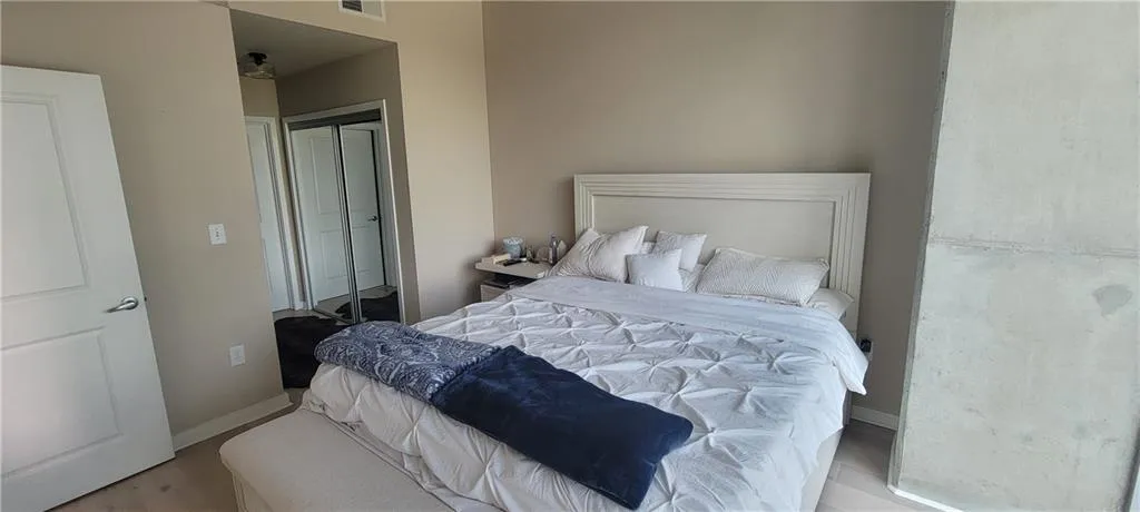 Bedroom featuring a closet, baseboards, and visible vents