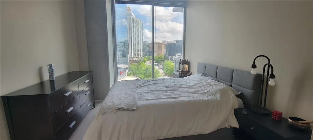 Bedroom with a view of city