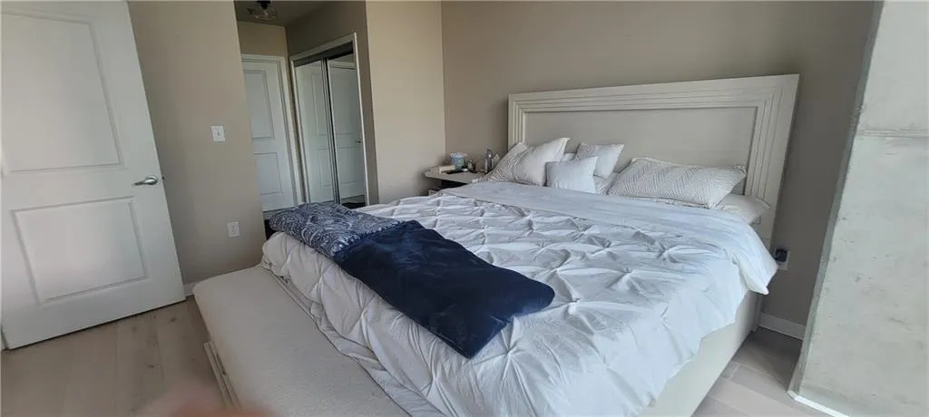 Bedroom featuring a closet and wood finished floors
