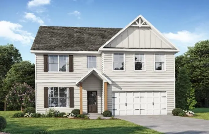 Two-story residence featuring light-colored siding, a dark shingle roof, and a prominent front-facing gable with decorative trim