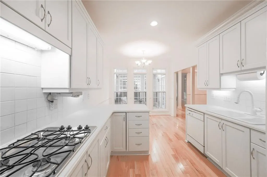 All white kitchen. Pretty as-is but easy to update.