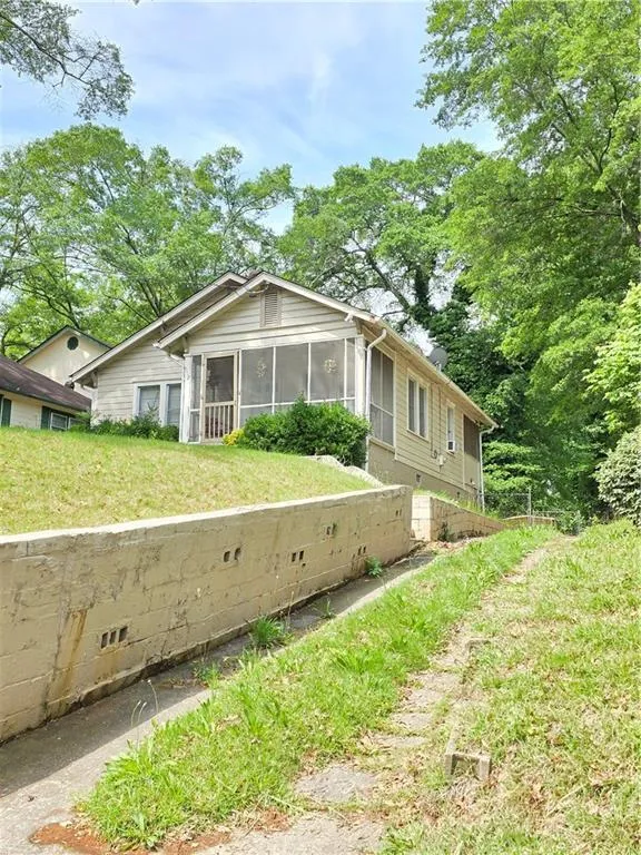 View of front of house featuring a sunroom