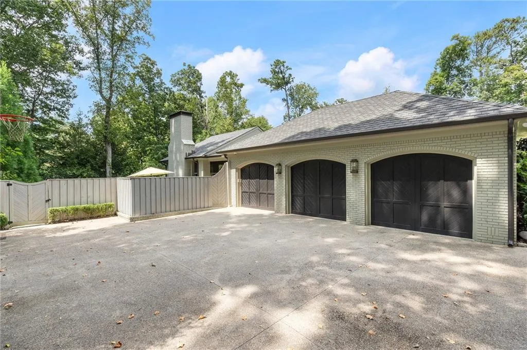 3 car garage and motor court.