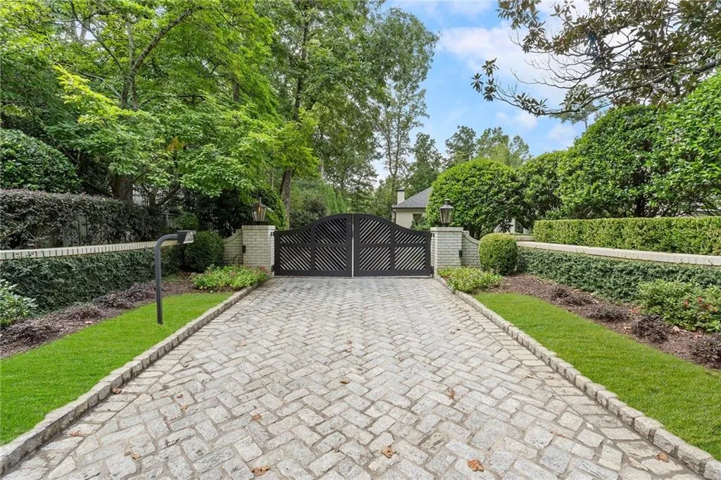 Circular drive with double gates. Professional landscaped for maximum privacy.