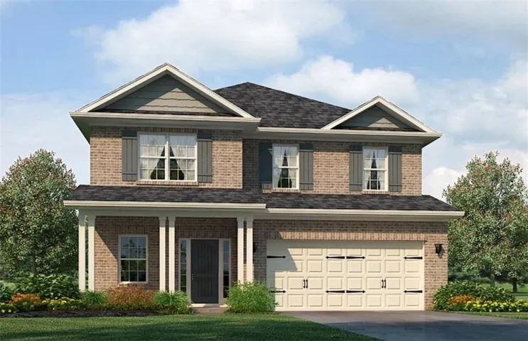 Brick facade home with a covered front porch featuring white columns