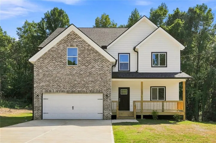 Brick and siding exterior with a covered porch