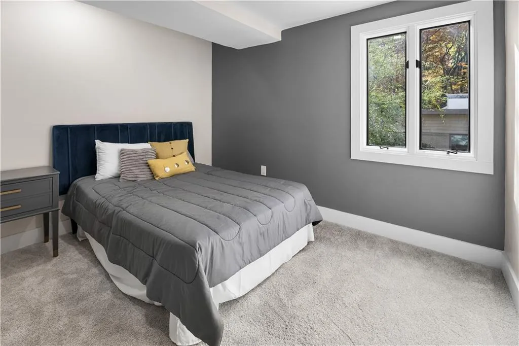 Carpeted bedroom with baseboards