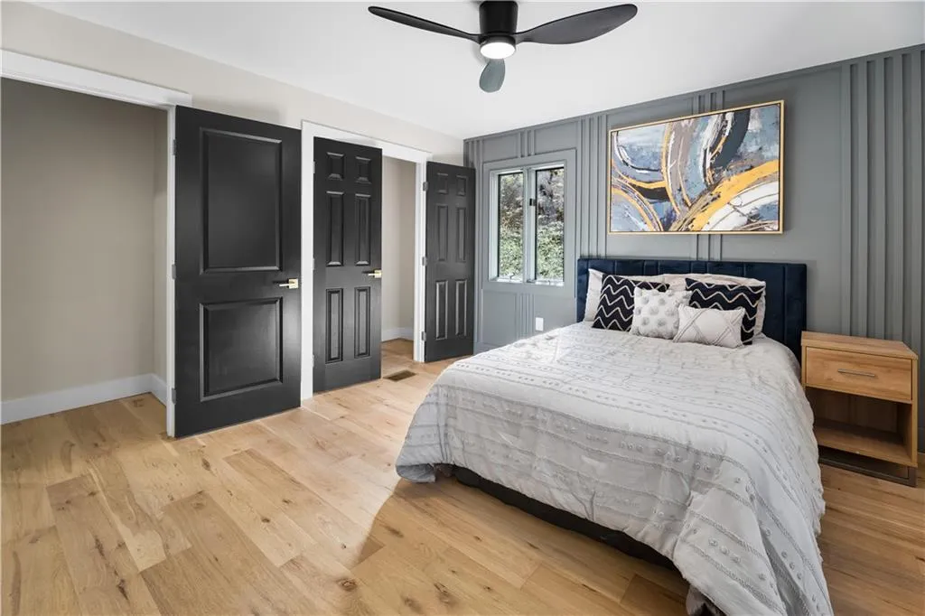 Bedroom featuring light wood-style flooring and ceiling fan