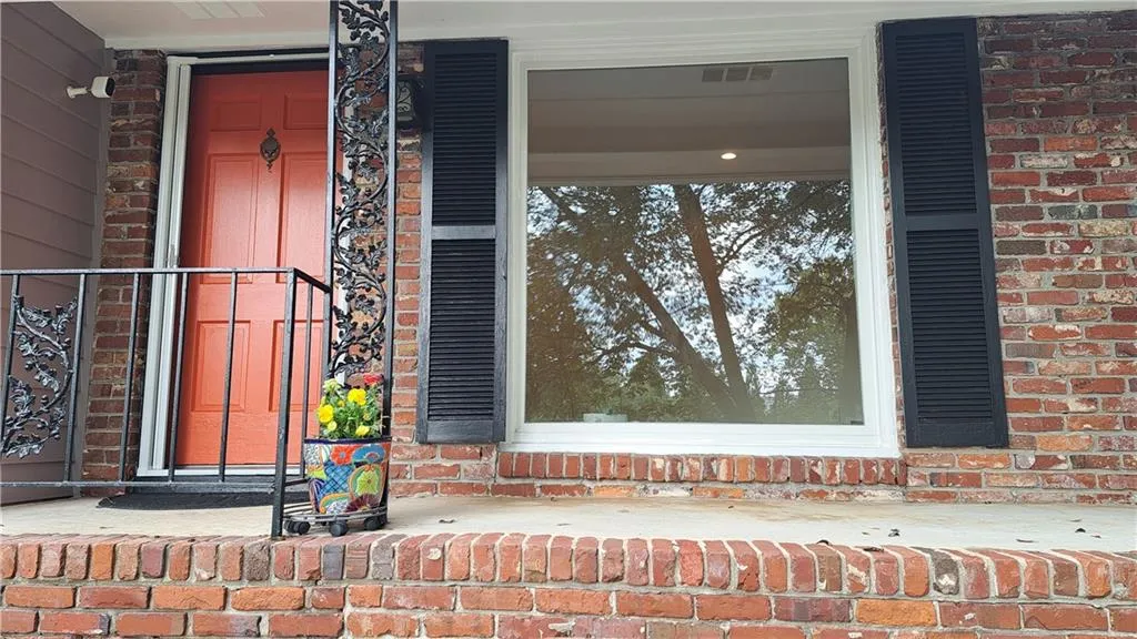 Front entry. Windows in living room, dining room & kitchen have been replaced.