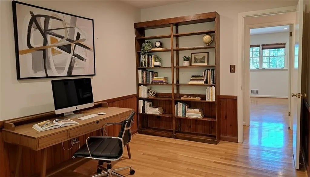 Bedroom #4 (or Office) with loriginal hardwood flooring, wainscoting, & genuine walnut bookcase (rear of house)