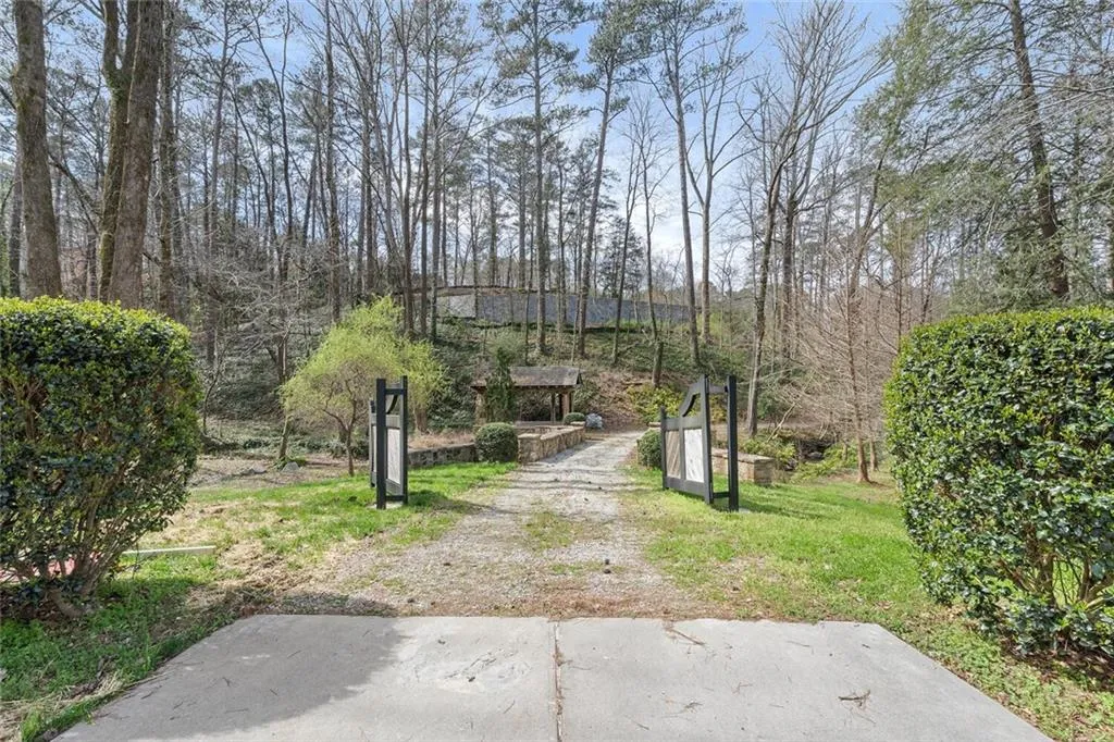 Gated property with stone bridge.