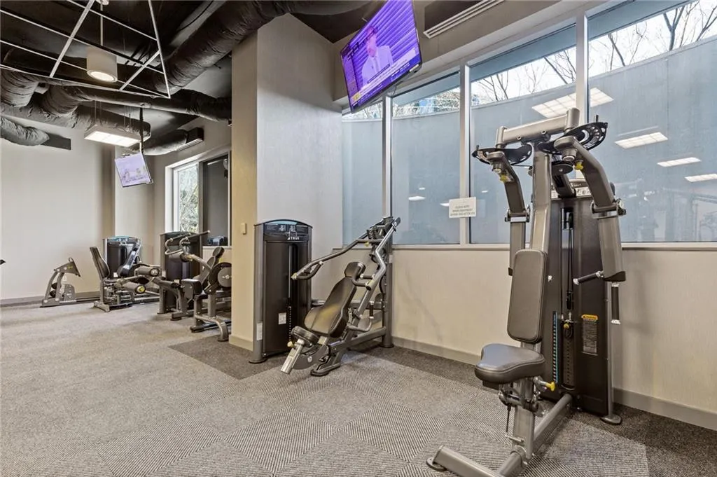 Workout area featuring baseboards