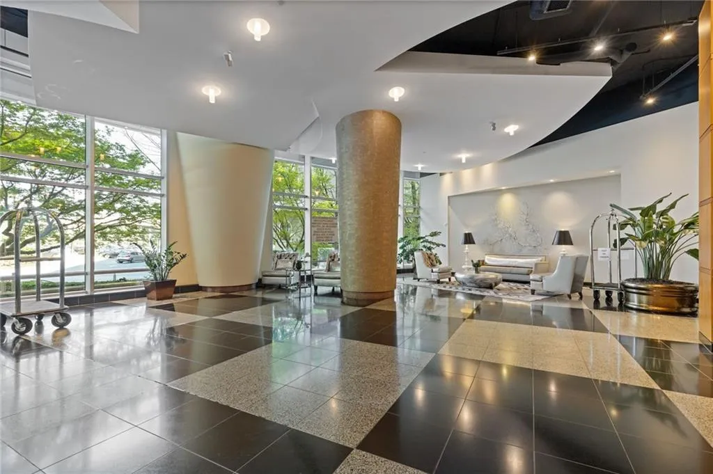 Community lobby featuring a high ceiling and expansive windows