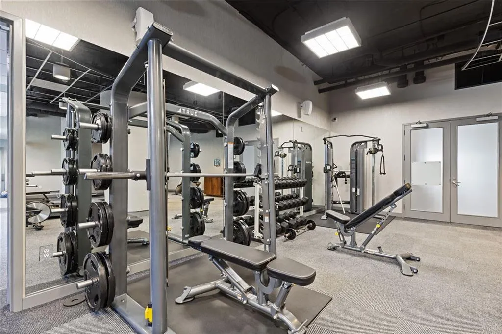 Gym featuring french doors