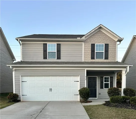 View of front of property with a garage