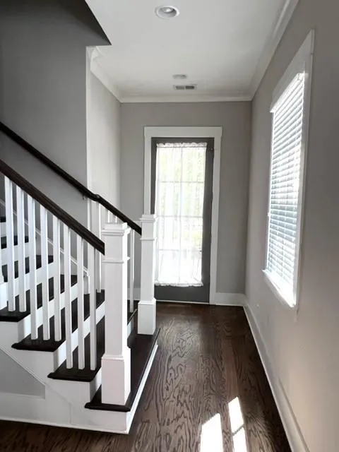 wood finished floors, and stairway