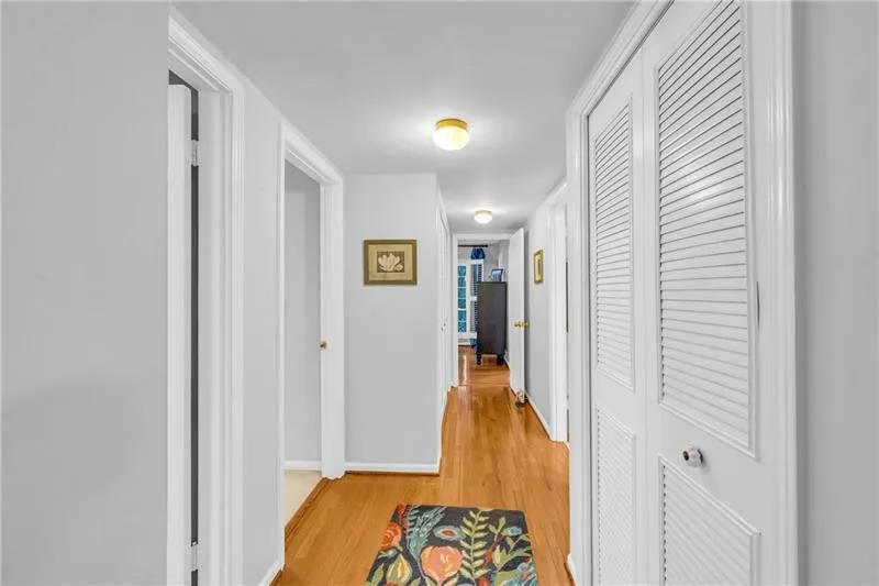 Hallway with view to primary bedroom