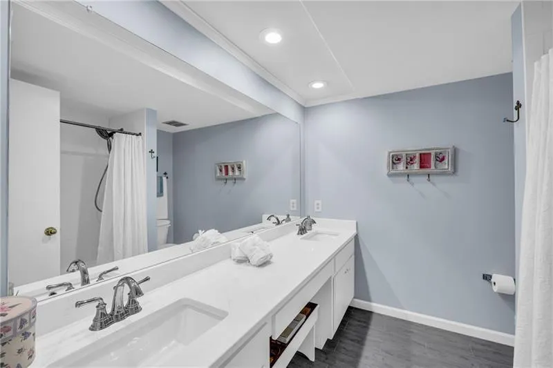 Primary Bathroom featuring double vanity