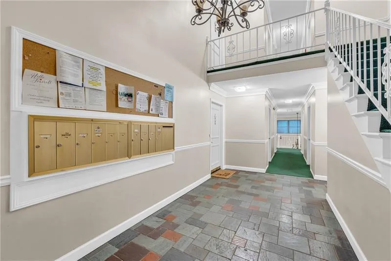 Building Foyer and mailboxes. Home is straight ahead in back of the building on right.