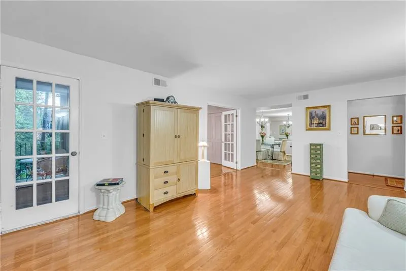 Living room with light hardwood / wood-style floors
