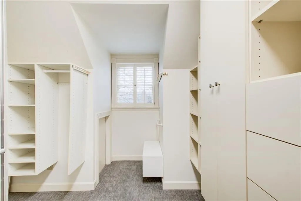 Walk in closet in primary bedroom