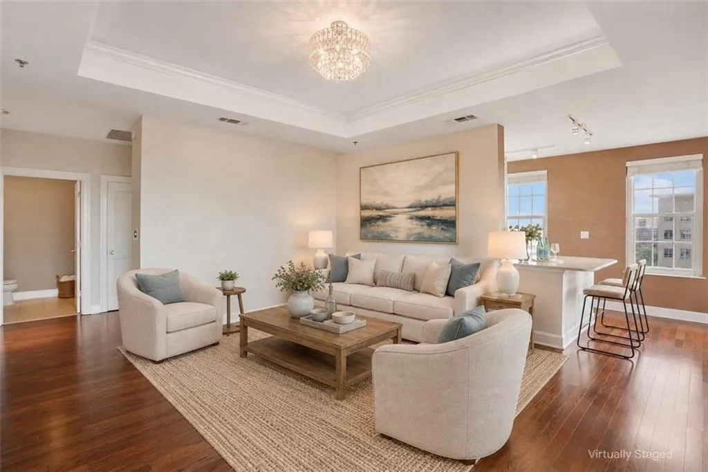 Tray ceiling with crown molding and a crystal chandelier