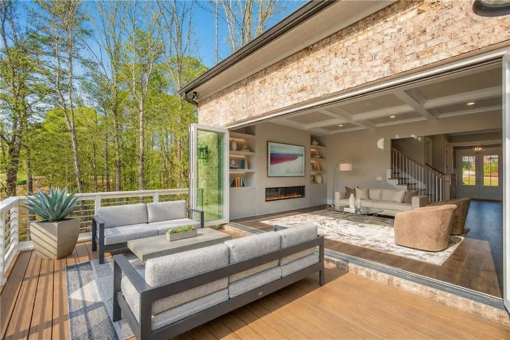Wooden terrace with outdoor seating and french doors