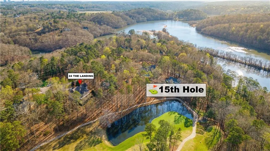 Bird's eye view of a nearby body of water and a heavily wooded area