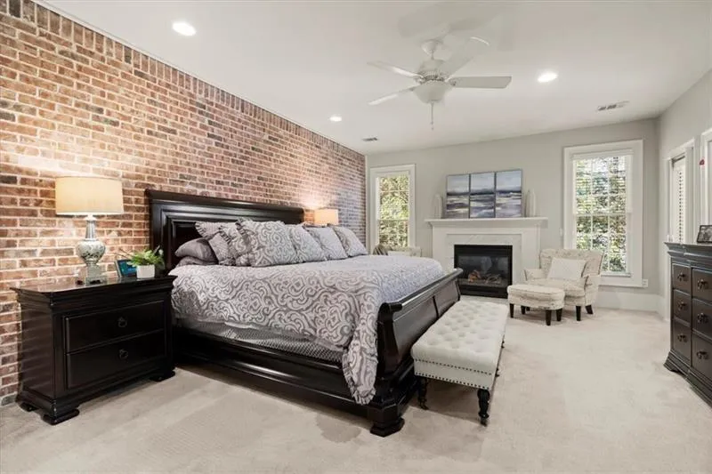 The Primary Bedroom with the 2nd out of 3 fireplaces.