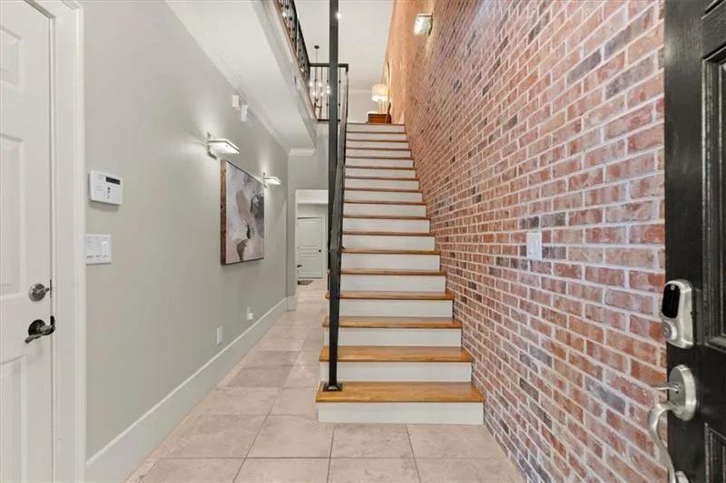 Front entry hall with door to garage on the left.
