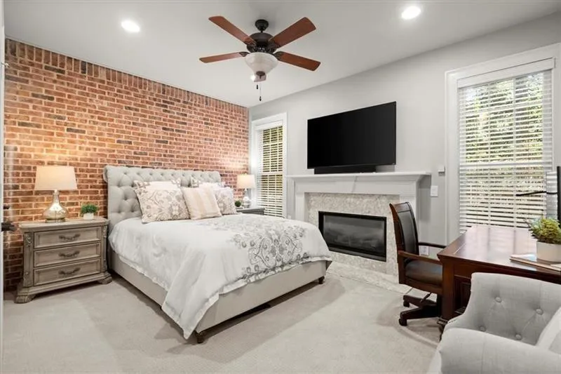 Bedroom on main level. 3rd fireplace out of 3.