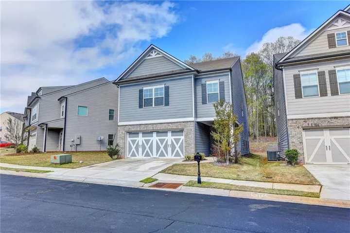 Two-story exterior with horizontal siding and brick-finish foundation