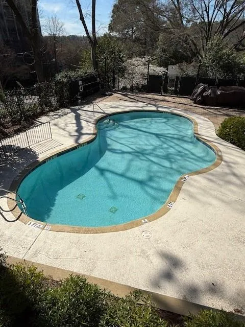 Community pool featuring a patio