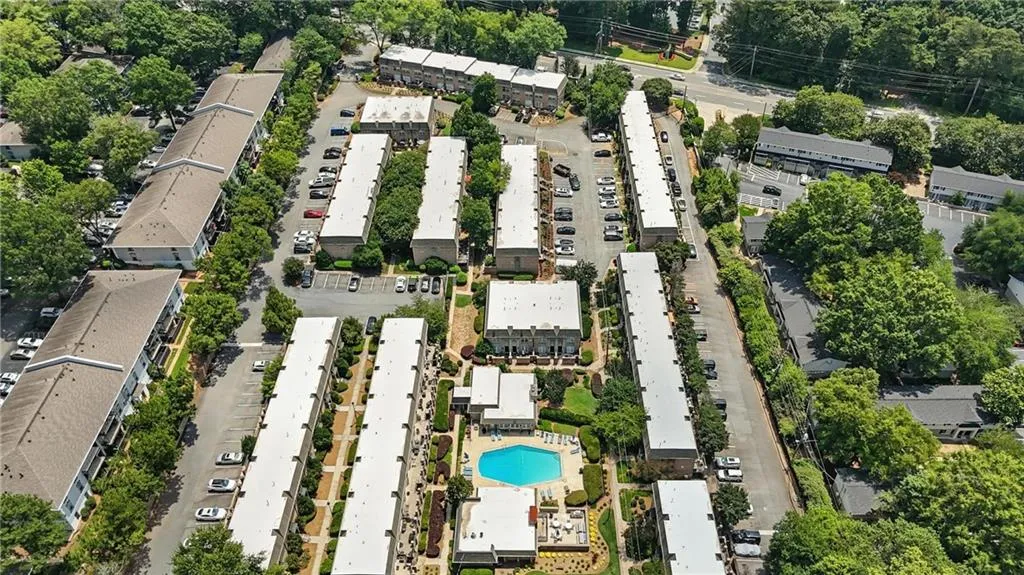 Aerial view of property's location featuring a pool