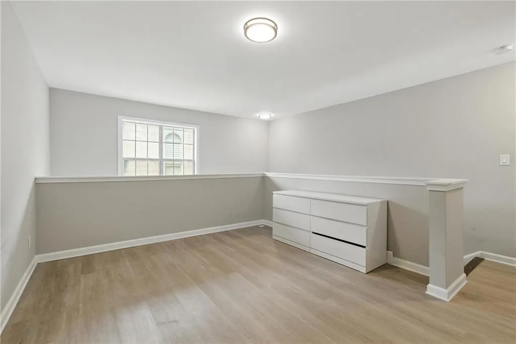 Unfurnished room featuring wood finished floors