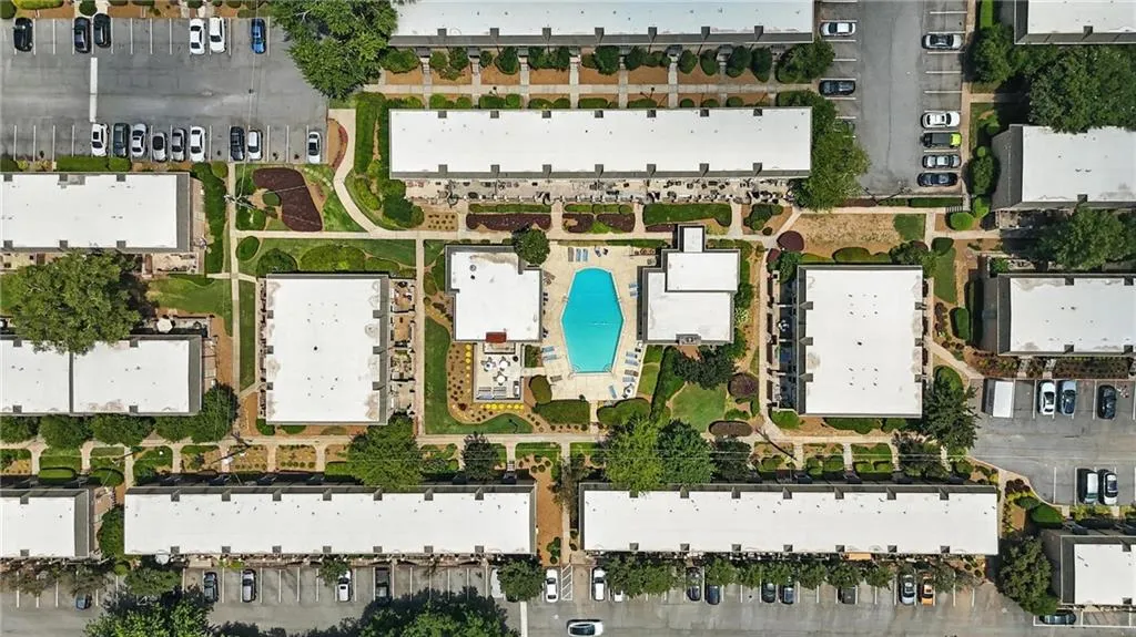 Aerial view of property's location with a pool