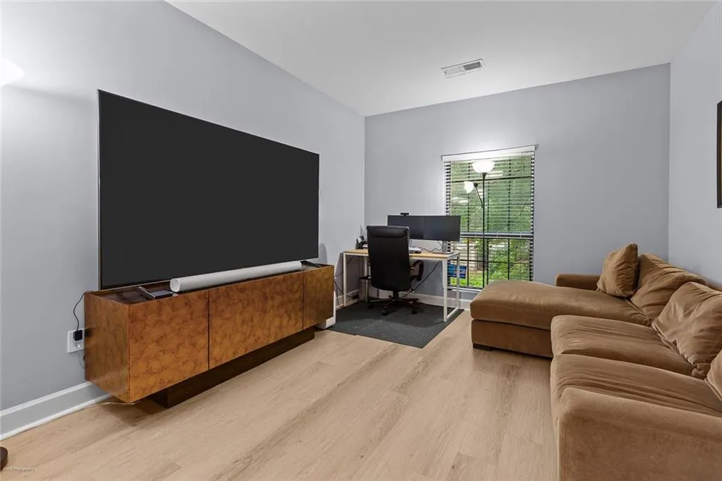 Home office featuring light wood-style flooring and baseboards