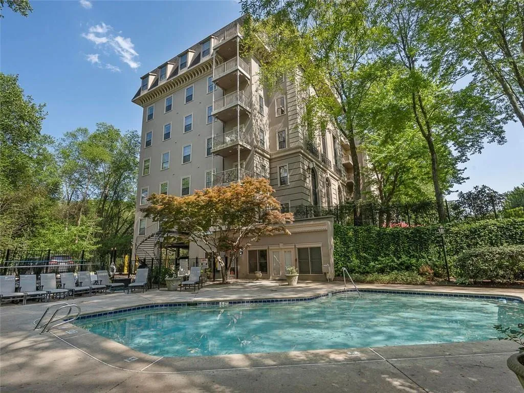 Community pool with a patio area