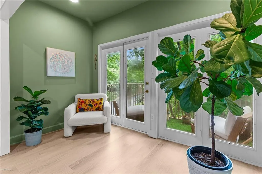 Doorway to outside with wood finished floors and baseboards